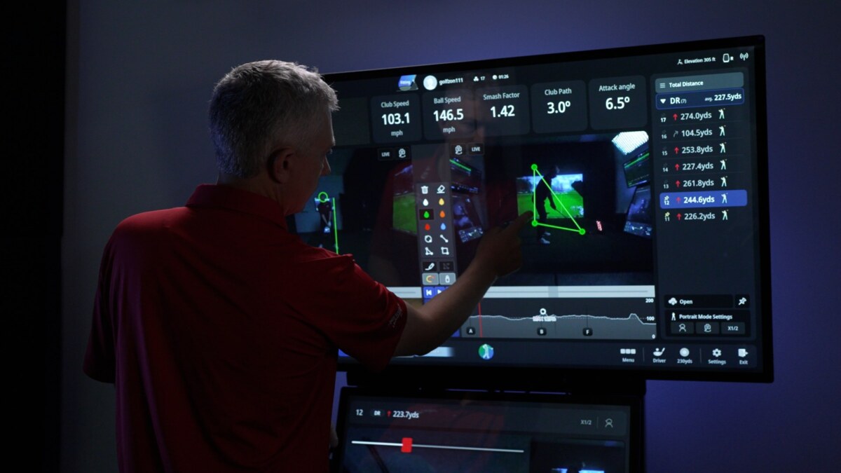 An image of a touch monitor showing golf course statistics such as ball speed, club path, attack angle, and club path.